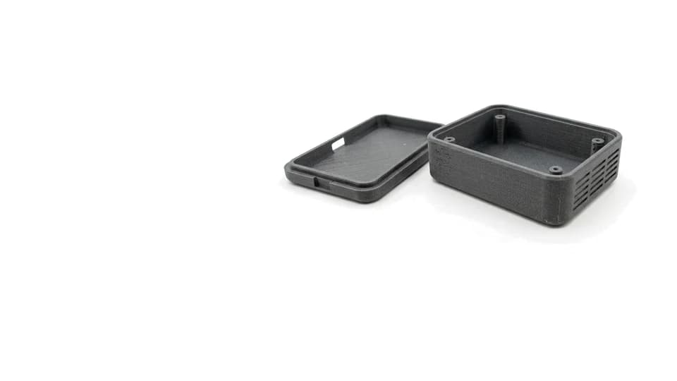 A two-part 3D printed electronics enclosure, photographed on white